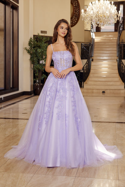 Elevate your prom night with the Nox Anabel H1880, a stunning A-line silhouette that commands attention. This backless design features a sheer corset bodice with strategic cutouts, delicate spaghetti straps, and a graceful train that flows from a straight neckline. Perfect for those seeking a bold, sophisticated look that balances elegance with modern edge. An unforgettable choice for your most important evening.

Sizes: 00-16

Colors: Emerald, Lilac