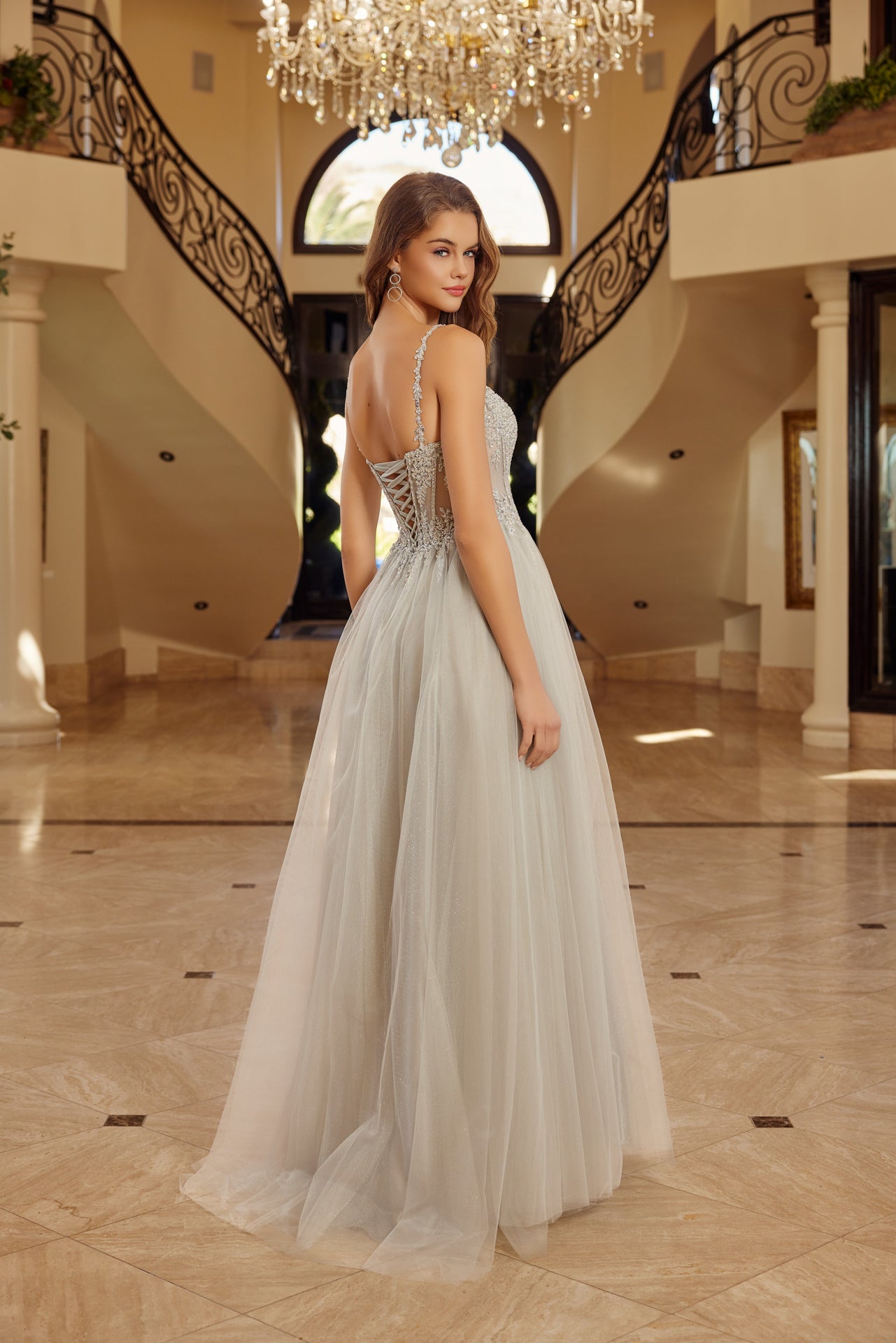 Make a statement in this Nox Anabel F1726 prom dress, featuring a sheer sequin corset bodice that catches the light with every movement. The structured A-line silhouette flatters your figure while the plunging V-neckline adds sophisticated allure. A graceful train completes the look with timeless elegance. Perfect for prom night or formal events where you want to feel confident and radiant.

Sizes: 00-16


Colors: Champagne, Greenery, Silver, Smoky Blue
