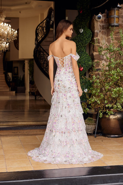 Nox Anabel's G1916 is a show-stopping prom dress designed for those who want to make an unforgettable entrance. This mermaid silhouette features a sheer sequin floral corset bodice that catches light with every movement, paired with an elegant off-the-shoulder neckline and plunging sweetheart cut. Dramatic ruffle detailing adorns the voluminous train, while a thigh-high slit adds modern sophistication and ease of movement. Perfect for prom, formal galas, or any black-tie event where you want to command atte