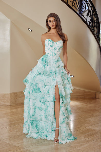 Elevate your prom night with the Nox Anabel T1865, a stunning strapless gown designed to turn heads. This dramatic dress features a pleated sweetheart neckline that frames the shoulders beautifully, paired with a structured corset bodice for a flattering silhouette. Cascading ruffles add movement and dimension, while the daring low back and thigh-high slit create an unforgettable look. A sweeping train completes the editorial elegance. Perfect for prom, formal galas, or any black-tie occasion where you want