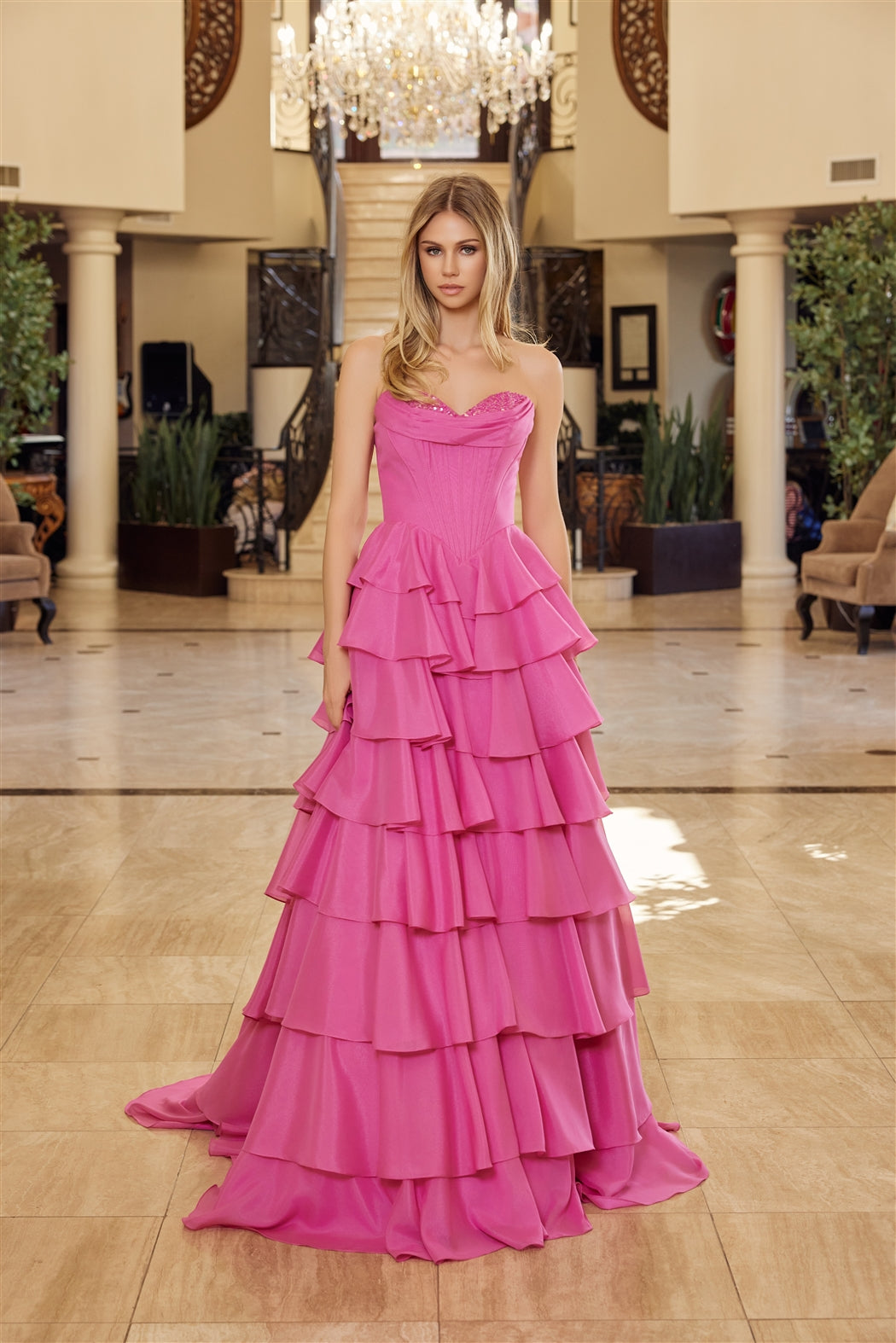 Nox Anabel's Y1806 prom dress combines timeless elegance with modern glamour. The strapless sweetheart neckline frames the shoulders beautifully, while intricate sequin detailing catches light with every movement. A structured corset bodice provides flattering support and definition, flowing into voluminous ruffled layers that create dramatic movement. The low back design adds sophisticated allure, and the sweeping train makes a striking entrance. Perfect for prom, formal galas, or any black-tie occasion wh