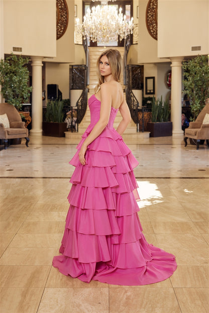 Nox Anabel's Y1806 prom dress combines timeless elegance with modern glamour. The strapless sweetheart neckline frames the shoulders beautifully, while intricate sequin detailing catches light with every movement. A structured corset bodice provides flattering support and definition, flowing into voluminous ruffled layers that create dramatic movement. The low back design adds sophisticated allure, and the sweeping train makes a striking entrance. Perfect for prom, formal galas, or any black-tie occasion wh