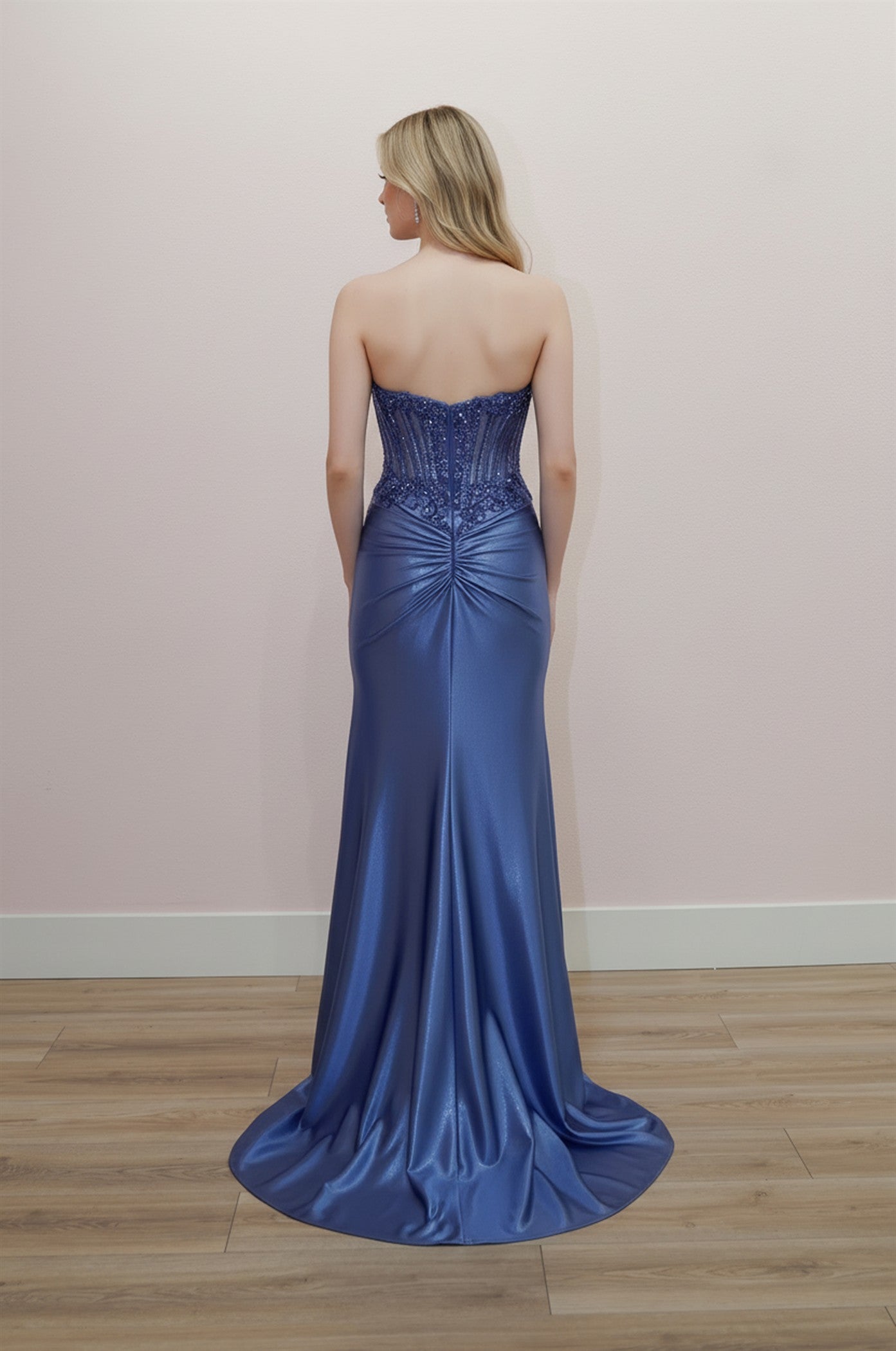 Elevate your prom night with the Nox Anabel E1902, a stunning strapless gown that commands attention. This exquisite dress features a sheer beaded corset bodice that hugs your silhouette with precision, paired with a dramatic slit train that moves with grace. The sweetheart neckline and low back create an alluring, sophisticated look perfect for making an unforgettable entrance. Intricate beadwork catches the light with every step, while the flowing skirt ensures you'll feel like the star of the evening. A 