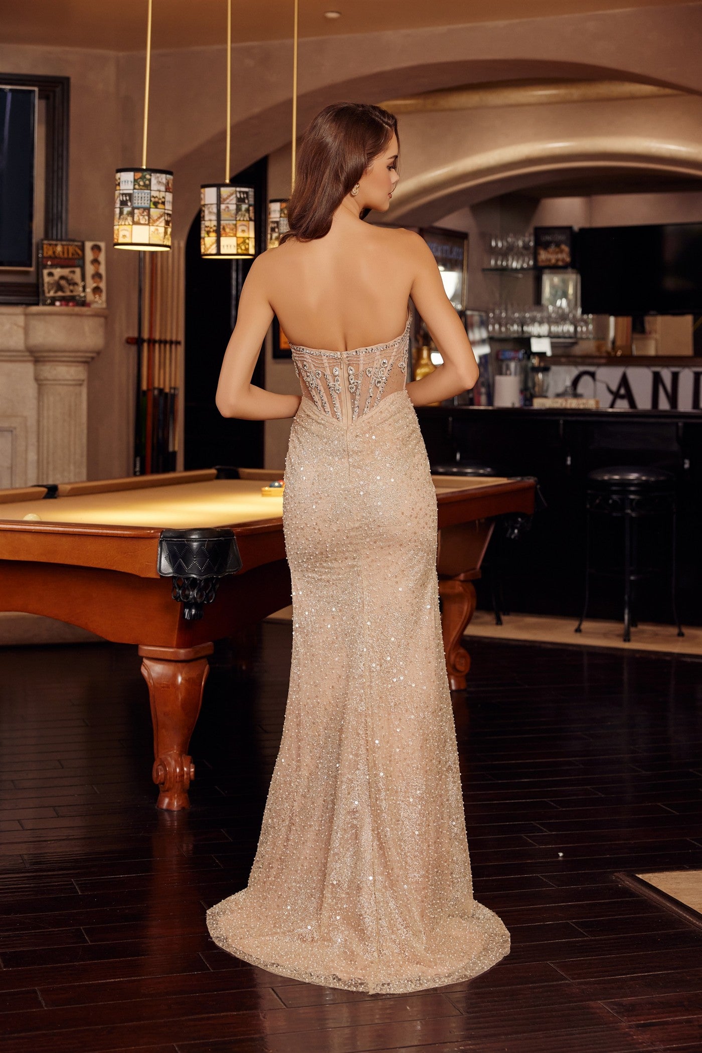 Elevate your prom night with the Nox Anabel G1796, a stunning strapless gown that commands attention. The scoop neckline frames your shoulders beautifully, while intricate sheer crystal detailing adorns the corset bodice for a touch of glamour. A dramatic slit and low back create an alluring silhouette, and the flowing train adds timeless elegance as you make your entrance. Perfect for those seeking a show-stopping formal look that balances sophistication with modern edge.

Sizes: 00-16

Colors: Champagne&n