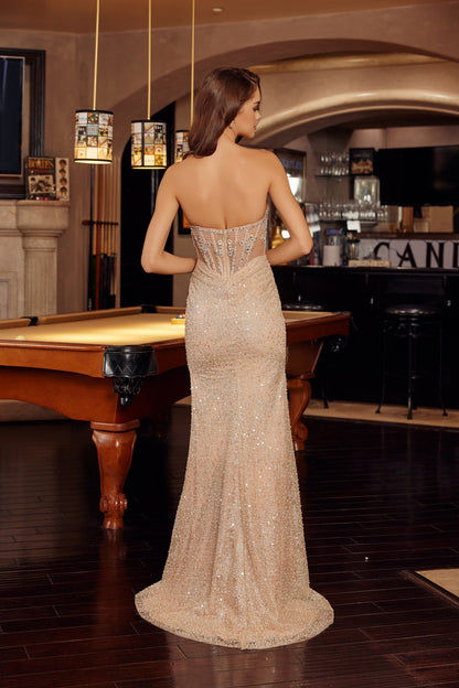 Elevate your prom night with the Nox Anabel G1796, a stunning strapless gown that commands attention. The scoop neckline frames your shoulders beautifully, while intricate sheer crystal detailing adorns the corset bodice for a touch of glamour. A dramatic slit and low back create an alluring silhouette, and the flowing train adds timeless elegance as you make your entrance. Perfect for those seeking a show-stopping formal look that balances sophistication with modern edge.

Sizes: 00-16

Colors: Champagne&n