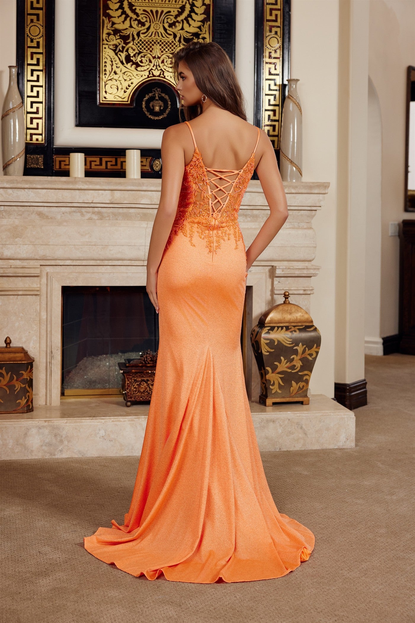 Elevate your prom night with the Nox Anabel H1875, a stunning V-neck gown that commands attention. This sophisticated dress features a sheer beaded corset bodice adorned with intricate sequin detailing, creating a luminous focal point. Delicate spaghetti straps provide elegant support, while the dramatic slit and sweeping train add movement and glamour. The backless silhouette offers a daring, modern edge perfect for making an unforgettable entrance. Crafted for the discerning guest who refuses to blend in,