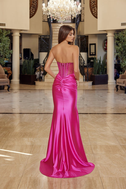 Elevate your prom night with the Nox Anabel R1812, a stunning strapless satin gown that commands attention. This sophisticated design features a sheer crystal-embellished corset bodice with a flattering V-neckline and pleated detailing that creates graceful movement. The luxurious satin skirt flows into a dramatic slit and sweeping train, while the backless silhouette adds an alluring touch of elegance. Perfect for those seeking a show-stopping formal look that balances glamour with refined style.

Sizes: 0