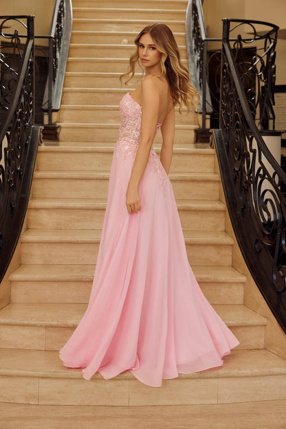 Nox Anabel's C1617 prom dress combines timeless elegance with modern glamour. The sheer sequin and beaded corset bodice creates a striking focal point, while the sweetheart neckline and strapless design offer a romantic silhouette. The A-line skirt provides graceful movement and flattering proportions. A daring backless cut adds contemporary edge to this show-stopping gown, perfect for prom, formal events, or special occasions where you want to make an unforgettable entrance.

Sizes: 00-16

Colors: Lemon, P