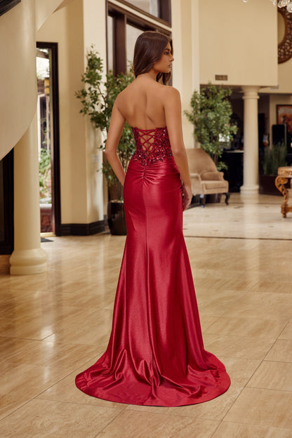 Elevate your prom night with the Nox Anabel C1630, a stunning strapless gown that commands attention. This show-stopping dress features a sheer corset bodice adorned with intricate sequin detailing, a sweetheart neckline, and a dramatic slit train. The backless design adds an alluring touch of sophistication, making it perfect for those seeking a bold, glamorous statement. Crafted for the modern prom-goer who refuses to blend in, this gown combines elegance with edge for an unforgettable evening.

Sizes: 00