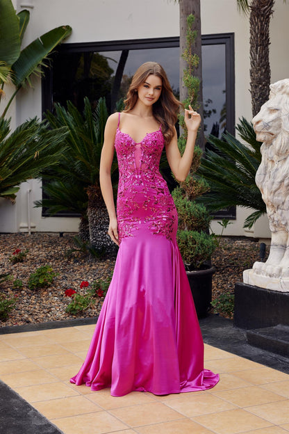 Elevate your prom night with the Nox Anabel E1532, a stunning mermaid silhouette that commands attention. This show-stopping gown features a sheer corset bodice adorned with intricate floral sequin detailing, creating a mesmerizing interplay of light and texture. The sweetheart neckline and delicate spaghetti straps frame the shoulders beautifully, while the low back adds an alluring touch of sophistication. A dramatic mermaid train flows gracefully behind you, ensuring you make an unforgettable entrance. P