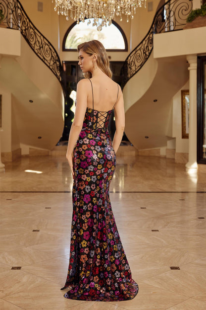 Make an entrance in the Nox Anabel T1511, a show-stopping prom dress designed for unforgettable moments. This plunging sweetheart neckline frames the décolletage beautifully, while intricate floral sequin detailing catches light with every movement. Delicate spaghetti straps provide elegant support, and the dramatic slit and train create a graceful silhouette that commands attention. The backless design adds modern sophistication and allure. Perfect for prom, formal galas, or any black-tie event where you w