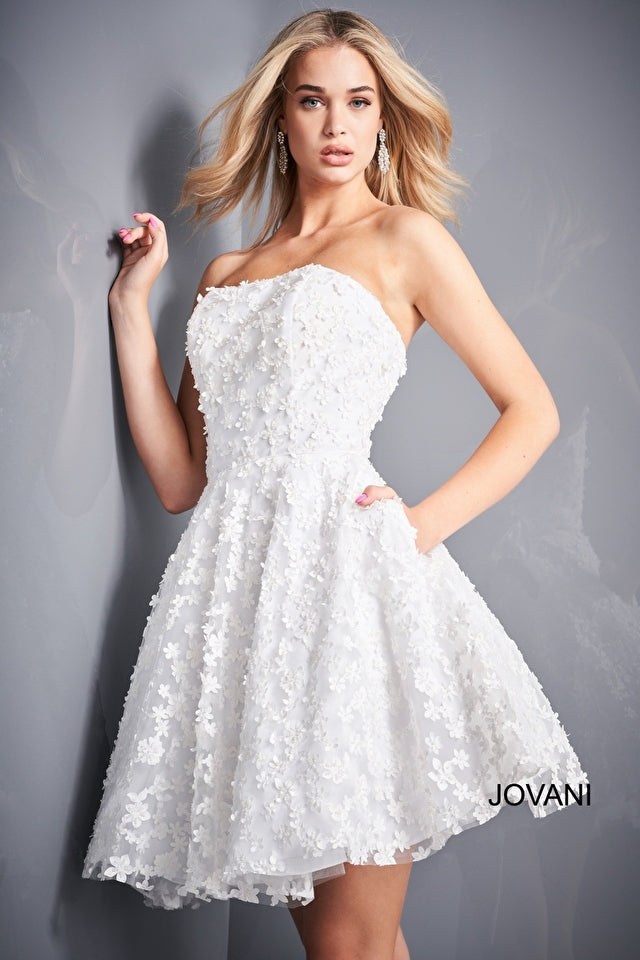 Jovani K02564 Fit and Flare Strapless Floral Girls Short Dress. Add some garden-inspired glamour to any occasion with this Jovani K02564 dress! Crafted from a luxe floral fabric, this fit and flare strapless dress will make your little girl look like she just stepped out of the fairytale. Flounce around in style!