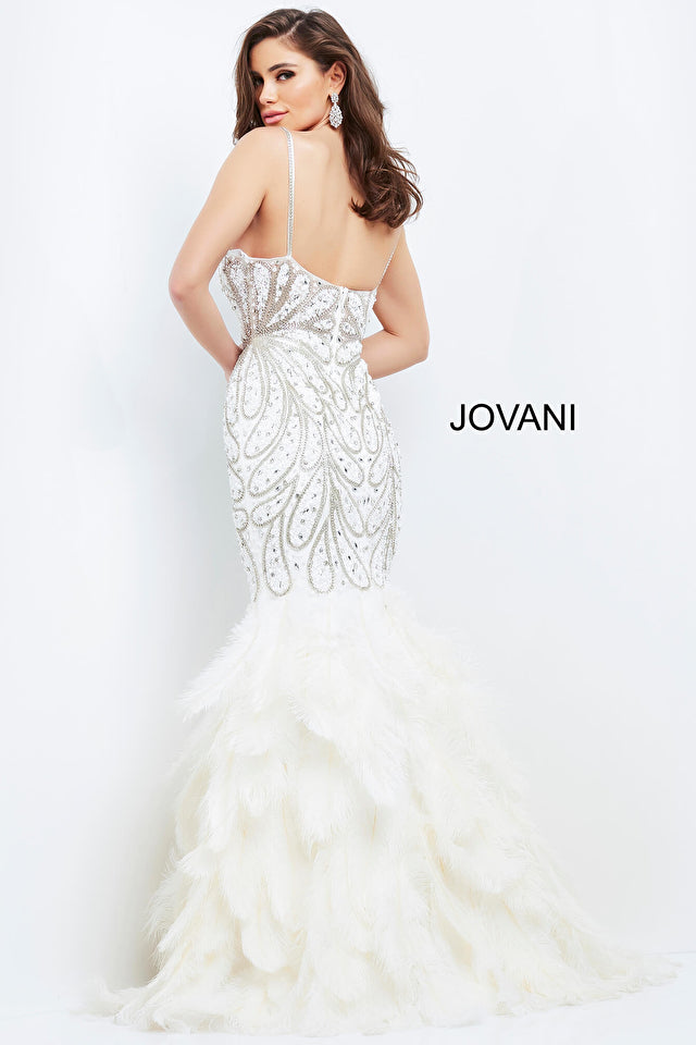 This Jovani long feather mermaid skirt dress features a form-fitting silhouette, crystal-bodice, spaghetti straps, and a plunging neckline with a sheer mesh insert. The comfortable open-back and dramatic floor-length enable you to make a stunning statement at any formal event or bridal pageant.  Sizes: 00-24  Colors: Black, Off White