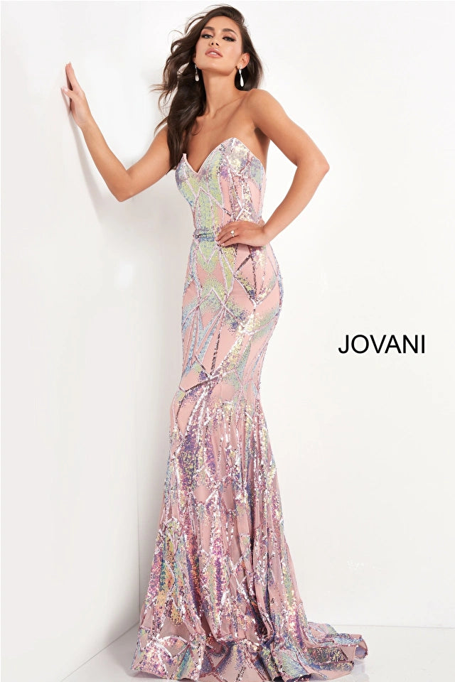 Jovani 05100 is a long Fitted formal evening gown. Featuring a strapless peak - deep sweetheart neckline. This stunning Pageant & Prom Gown is Fully Embellished with Glitter & Sequins to Create A Glamorous Geometric dimensional design. Mermaid silhouette with a lush trumpet skirt & sweeping train.   Closure: Invisible Back Zipper with Hook and Eye Closure.