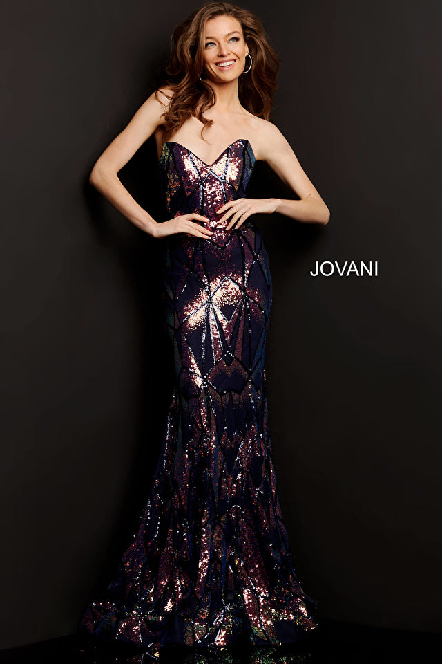 Jovani 05100 is a long Fitted formal evening gown. Featuring a strapless peak - deep sweetheart neckline. This stunning Pageant & Prom Gown is Fully Embellished with Glitter & Sequins to Create A Glamorous Geometric dimensional design. Mermaid silhouette with a lush trumpet skirt & sweeping train.   Closure: Invisible Back Zipper with Hook and Eye Closure.