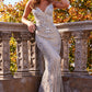 Jovani 05752 This is a silver and nude long mermaid prom dress with embellished lace throughout the evening gown.  It has a v neckline and spaghetti straps.  Closure: Invisible Back Zipper with Hook and Eye Closure. Details: Embellished tulle prom gown, fully lined, floor length, form-fitting, spaghetti strap sleeveless bodice with plunging neckline and open back.