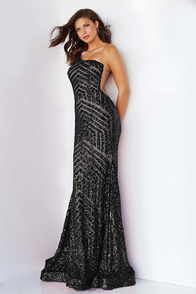 Jovani 06017 Long Mermaid Prom Dress.  This Jovani 06017 prom gown features a fit and flare silhouette in geometric sequins, detailed with a one-shoulder neckline and sheer plunging sides. Soft godets add volume to this glitter formal dress, finished with a horsehair hem and lush sweeping train