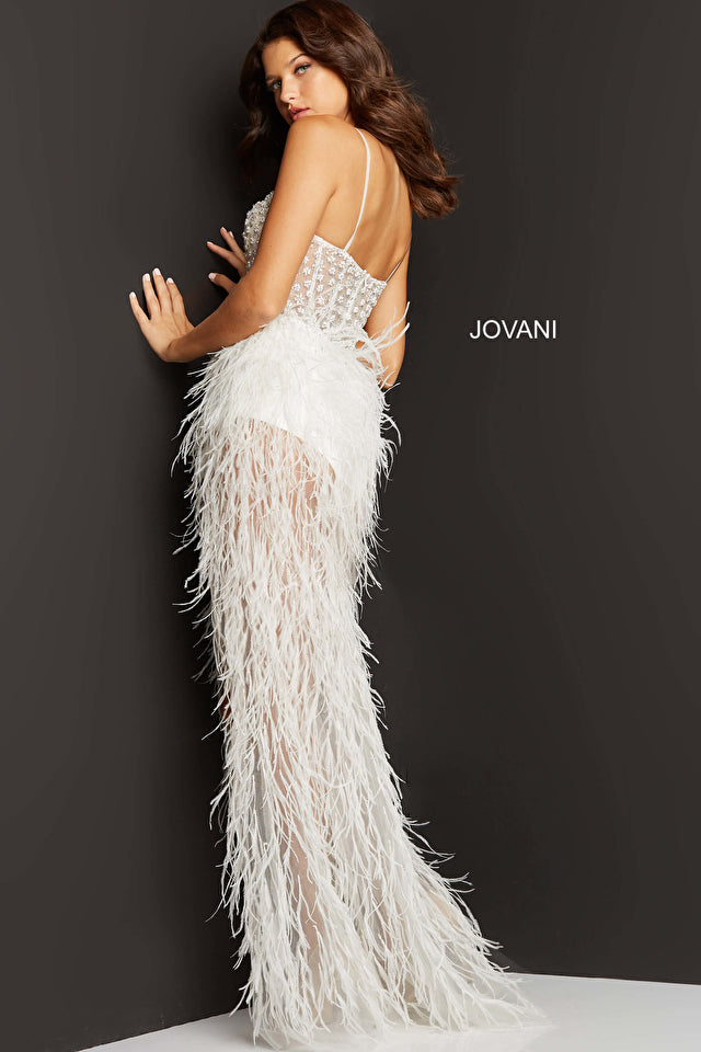Jovani 07591 Long Prom Dress sweetheart neckline spaghetti straps sheer bodice with beaded flower shaped matching stones.  It has a long sheer feather skirt with slit