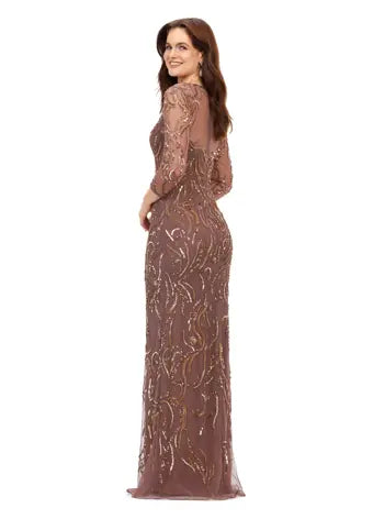 Ashley Lauren 11208 Three Quarter Sleeve Beaded Crew Neckline High Illusion Back Fully Hand Beaded Evening Gown. This gorgeous evening gown has a crew neckline, fitted mesh sleeves and a modern, intricate bead batter throughout. It is perfect for your next event.