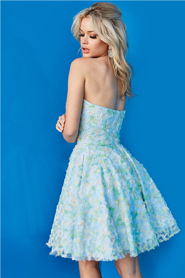 Jovani 07965 is a stunning strapless short cocktail homecoming dress. Crafted with a beautiful mix of multi-colored floral patterns, it features a fit and flare silhouette which flatters the body and shows off curves in all the right places. Make a statement in this eye-catching design.