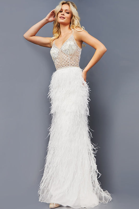 Jovani 08525 Floor-Length Feathered Skirt Fitted Beaded Sheer Bodice, V-Neckline, Straps Over Shoulders, Open Back Prom Dress. Capture the beauty of an evening in the Jovani 08525 dress. This fitted gown flaunts a sheer bodice embellished with beadwork, and a plunging V-neckline flanked by thin straps over the shoulders. An open back and floor-length feathered skirt complete this elegant yet modern design.