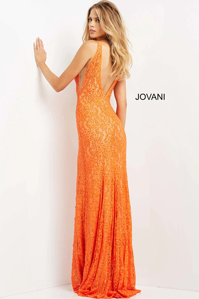 Jovani 08674 Form-fitting Stretch Lace Embellished With Heat Set Stones, Nude Underlay, Floor Length Skirt With A High Slit Plunging Neck Prom Dress. Make a stunning entrance in this Jovani 08674 prom dress. 