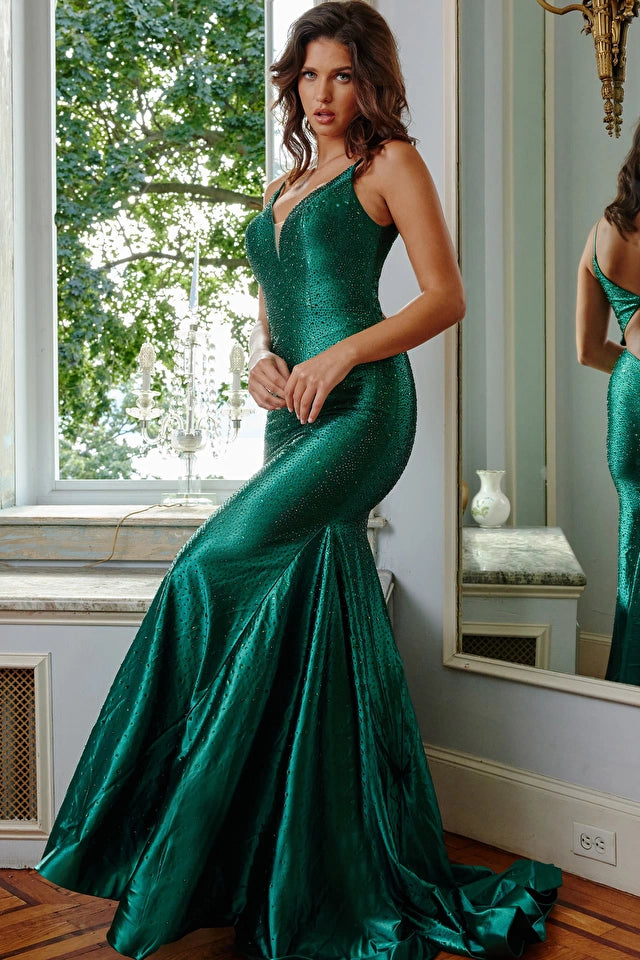Jovani 08157 Fully Embellished V-Neck Open Back Mermaid Fitted Prom Dress Fit and Flare. Experience the glamour of Jovani 08157 Plunging Neck Sheath Embellished Prom Dresses and make a lasting impression at your next formal event. Designed to accentuate your feminine silhouette, this dress features a form-fitting silhouette and a floor-length skirt with a flared bottom and sweeping train. The sleeveless bodice