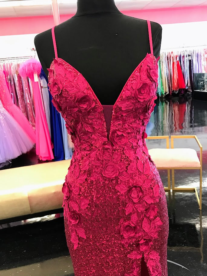 Jovani 1012 This is a Delicate all over sequin Embellished Prom Dress in Raspberry with Floral Appliques. Features a plunging neckline &amp; Slit in the skirt. Small Train in Back.&nbsp;

Details:&nbsp;Sequin stretch fabric, floral appliques, fitted silhouette, high slit skirt with sweeping train, sleeveless bodice, plunging neckline with sheer mesh insert, low back with strap across for support, spaghetti straps over shoulders.
&nbsp;
Fabric:&nbsp;100% Polyester.
Fit:&nbsp;The Model is 5'9" Wearing 3" Heel