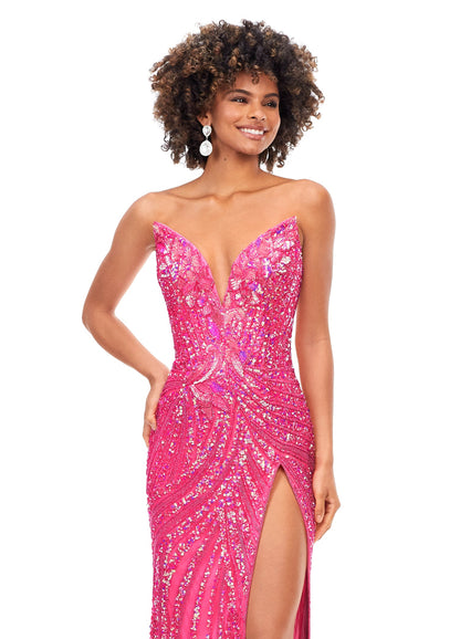 Ashley Lauren 11236 Long Fitted V Neck Slit Beaded Sequin Prom Dress Pageant Gown This strapless gown is sure to turn heads. The sweetheart neckline is complete with a modern floral sequin motif that continues down the bustier and skirt. The skirt is complete with a left leg slit. Strapless Bustier Left Leg Slit Fully Hand Beaded COLORS: Gold, Rose Gold, Gold/Black, Sky/Nude, Gold/Ivory, Fuchsia/Black, Purple, Red, Fuchsia, Bright Pink, Blue/Jade Sizes: 0-16