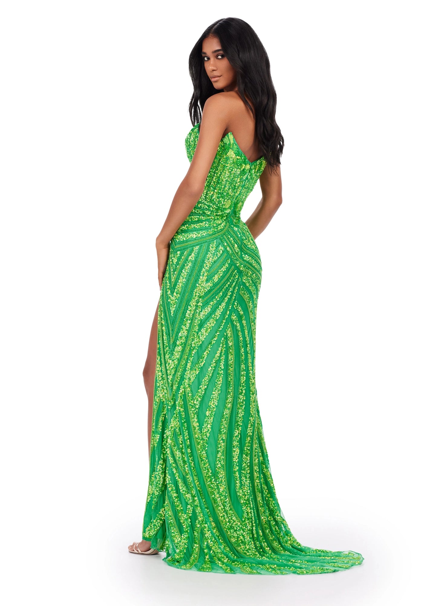 Ashley Lauren 11236 Long Fitted V Neck Slit Beaded Sequin Prom Dress Pageant Gown This strapless gown is sure to turn heads. The sweetheart neckline is complete with a modern floral sequin motif that continues down the bustier and skirt. The skirt is complete with a left leg slit.  COLORS: Blue/Jade, Candy Pink, Gold/Black, Lilac, Sky, Silver/Nude, Electric Lime, Bright Pink, Sky/Nude, Coral, Silver/Ivory, Turquoise/Royal, Rose Gold, Gold/Ivory, Red, Gold Sizes: 00-16