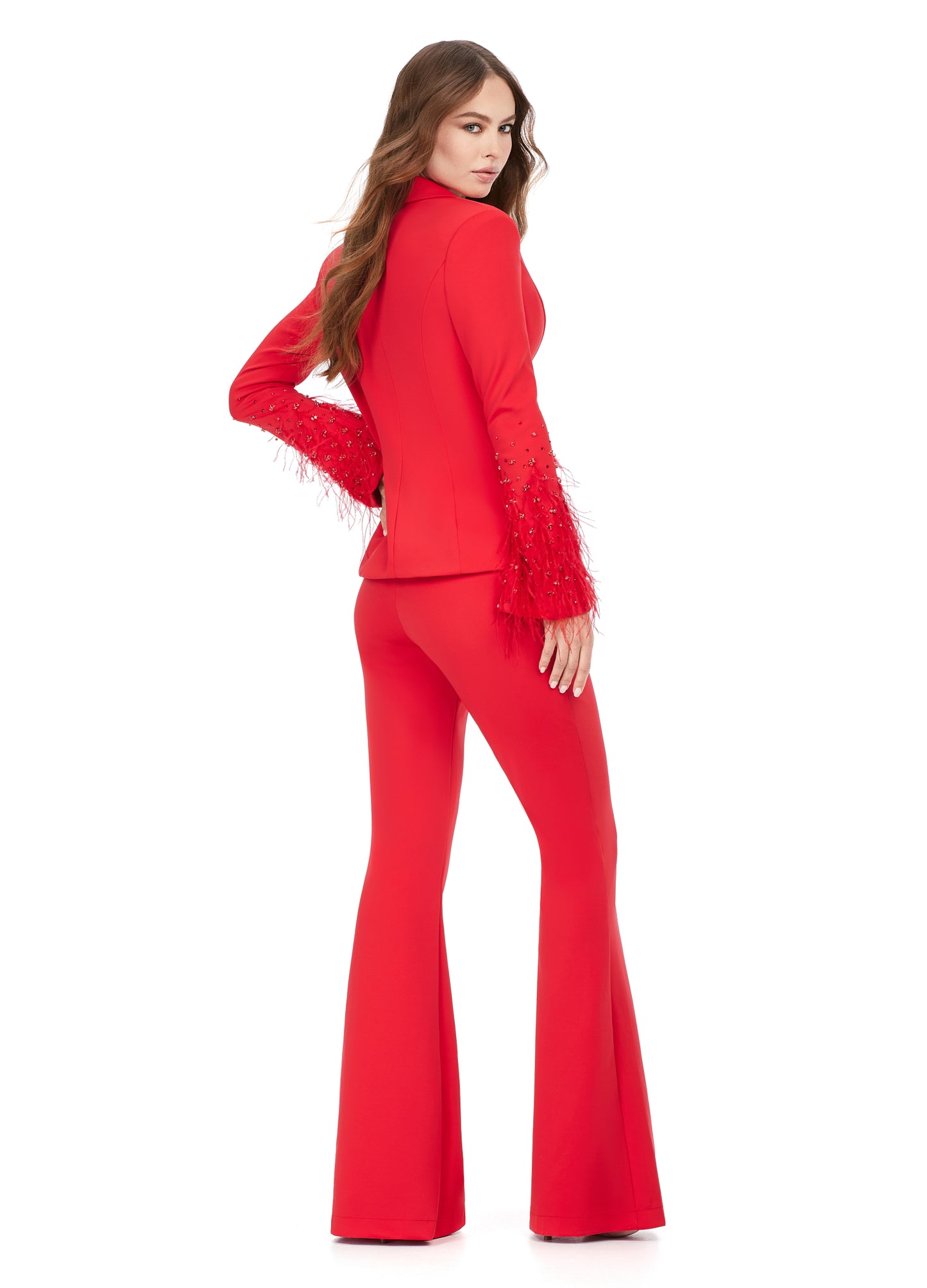 Ashley Lauren 11315 Long Sleeve With Feather And Crystal Accent Two Piece V-Neck Scuba Material Suit. We are obsessed with this suit! Made out of our signature scuba material, this two piece suit features stunning sleeve details with a mix of crystals and feathers. The pants have a flare bottom.