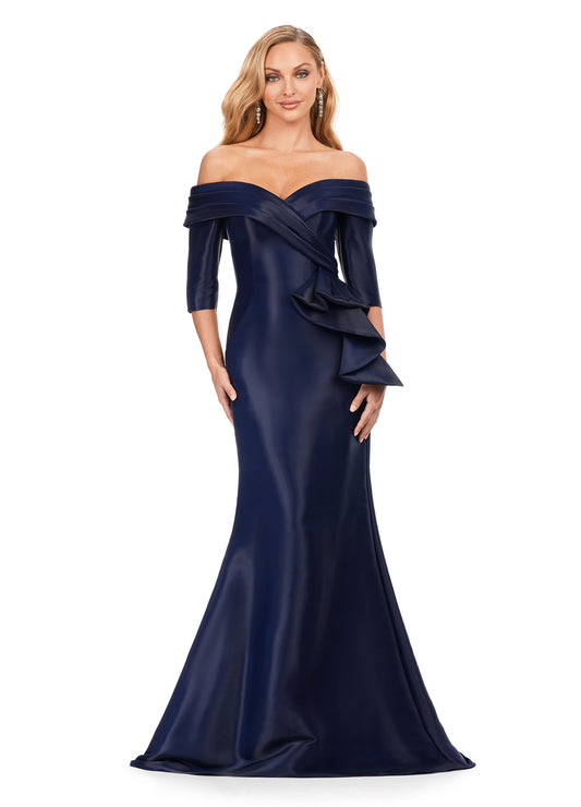 Ashley Lauren 11324 Phantom Satin Off The Shoulder Ruffle Detailing Mermaid Fitted Silhouette Evening Dress. This off the shoulder fitted mermaid gown features a ruffle at the hip. This elegant satin gown is the perfect staple for any event.