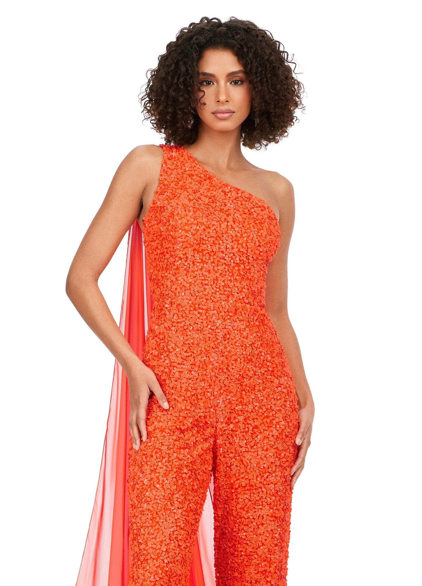 Ashley Lauren 11384 Fully Beaded With Removable Chiffon Cape One Shoulder Open Back Jumpsuit. Fall in love with this eye catching sequin jumpsuit! The one shoulder neckline is complete with a removable cape. The open back is adorned with sequin straps.