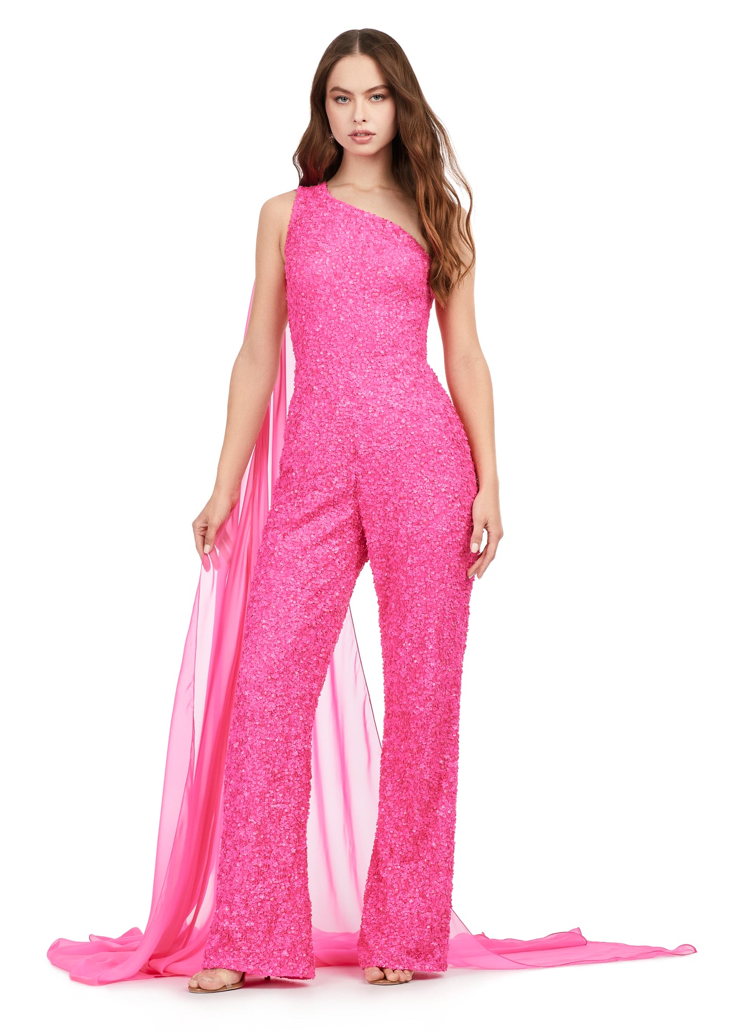 Ashley Lauren 11384 Fully Beaded With Removable Chiffon Cape One Shoulder Open Back Jumpsuit. Fall in love with this eye catching sequin jumpsuit! The one shoulder neckline is complete with a removable cape. The open back is adorned with sequin straps.