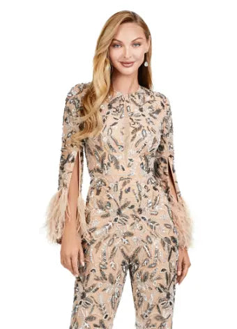 The Ashley Lauren 11394 Fully Beaded Jumpsuit with Feathers is a stunning choice for any formal event. This jumpsuit features intricate beading and elegant feather detailing, adding an extra touch of luxury. Designed by Ashley Lauren, a renowned expert in the fashion industry, this jumpsuit is sure to make a statement. Perfect for prom or any special occasion. Make a statement in this extravagant jumpsuit! Fully beaded with an open back and feathered cuffs, the details in this jumpsuit is sure to WOW!