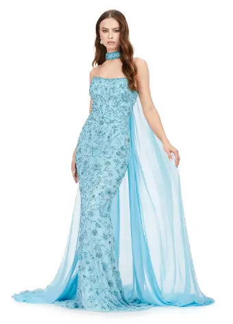 Dazzle everyone in this Ashley Lauren 11404 Long Prom Dress. The stunning strapless gown features intricate beading and a flowy chiffon cape. Perfect for formal events, prom, or pageants. Be the center of attention with this fully beaded gown and choker. Fall in love with this fully sequin strapless gown. With the sequin choker and chiffon cape this gown is sure to make a statement.
