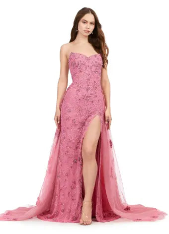 Elevate any special occasion in this exquisite Ashley Lauren 11405 Long Prom Dress. With a fully beaded strapless bodice and luxurious tulle overskirt, this formal pageant gown is the epitome of elegance. Be the center of attention and exude confidence in this stunning dress. Shine bright in this glamorous strapless, fully sequined gown. Paired with it's full tulle overskirt and glimmering beadwork, this gown is sure to stand out.