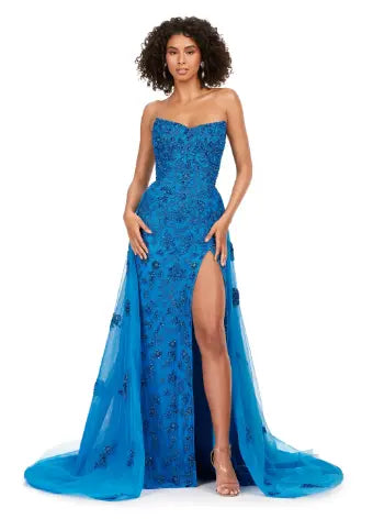 Elevate any special occasion in this exquisite Ashley Lauren 11405 Long Prom Dress. With a fully beaded strapless bodice and luxurious tulle overskirt, this formal pageant gown is the epitome of elegance. Be the center of attention and exude confidence in this stunning dress. Shine bright in this glamorous strapless, fully sequined gown. Paired with it's full tulle overskirt and glimmering beadwork, this gown is sure to stand out.