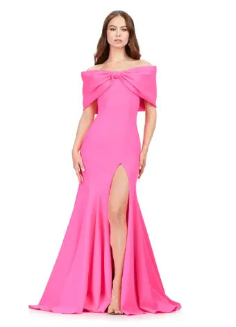Expertly designed for a flawless evening, the Ashley Lauren 11412 Long Prom Dress boasts an off-shoulder cut, scuba fabric, and an elegant oversized bow. Make an unforgettable statement at your next formal event with this stunning pageant gown. Make a statement in this elegant gown. The off shoulder bustier is complete with an oversized bow and the skirt has a left leg slit. dress that's paired with an oversized bow and leg opening.