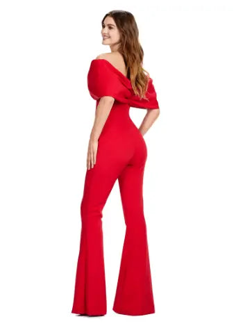 Make a statement at your next formal event with the Ashley Lauren 11414 Off Shoulder Scuba Jumpsuit. Its stylish off-shoulder design and oversized bow add a touch of elegance, while the scuba material provides a comfortable and flattering fit. Perfect for prom or any special occasion. Turn heads in this jumpsuit! This look is complete with an oversized bow off shoulder neckline.