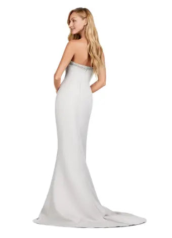 Combining elegance and modern style, the Ashley Lauren 11424 Long Prom Dress is perfect for any formal event. The fitted strapless design flatters your figure, while the oversized off-shoulder bow adds a touch of sophistication. With its stunning overlay and sleek silhouette, this dress will make you stand out in any pageant or evening occasion. Dazzle the crowd with this stunning strapless evening gown. The look is complete with a separate halter style overlay adding elegance to the look.