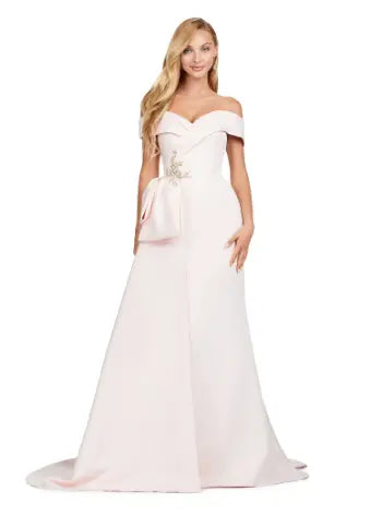 This Ashley Lauren 11425 Long Prom Dress is the perfect choice for any formal occasion. The off-shoulder design adds a touch of elegance, while the fitted satin fabric hugs your figure for a flattering silhouette. The overskirt adds a dramatic flare, making you feel like a pageant queen. Elevate your style with this versatile and stunning dress. An elegant off the shoulder neckline drapes the shoulders in elegant evening gown. The look is complete with beaded details and a side overskirt.
