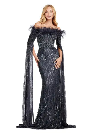 Expertly crafted by Ashley Lauren, the 11429 Long Prom Dress is a stunning piece that combines fully sequined fabric, delicate feathers, and elegant floor-length sleeves. Perfect for formal events and pageants, this gown is sure to make you stand out with its unique design and impeccable craftsmanship. Bring all the glamour in this fully beaded gown with floor length sleeves. The feather details take this look to the next level.