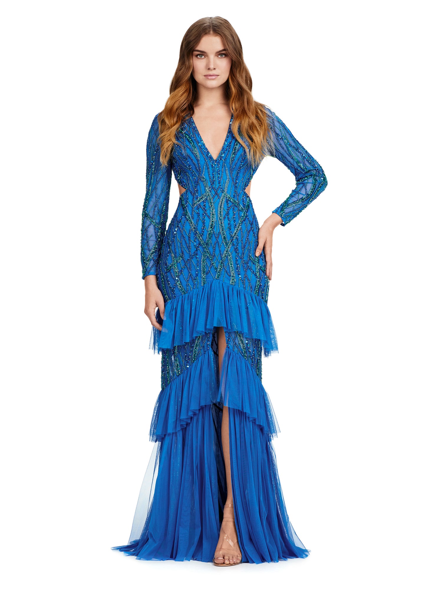 Step into elegance with the Ashley Lauren 11436 Long Prom Dress. This stunning gown features delicate beading, a flattering V-neckline, and a daring center slit with ruffled detailing. With its long sleeves, this dress is the perfect choice for a cool evening event. Make a statement in this formal gown. Fall in love with this gorgeous fully beaded long sleeve gown. Featuring an open back and center slit, this dress embodies effortless allure!