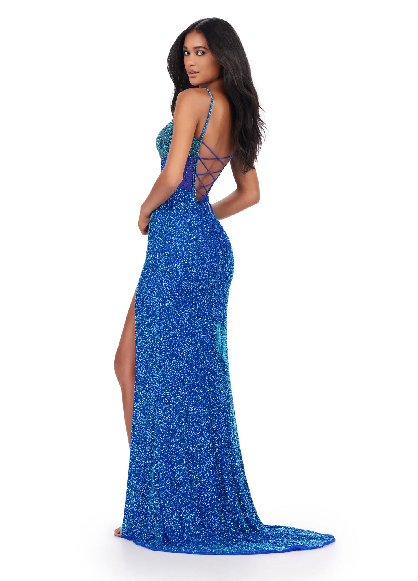 The Ashley Lauren 11448 is a stunning long gown for special occasions. It features a sequin-studded bodice with corset closure, side slit, and a backless design for a flattering silhouette. Perfect for proms, pageants, and formal events. All eyes will be on you in this fully beaded gown. The corset style bustier is embellished with crystals that are sure to dazzle. The left leg slit and lace up back complete the look. 