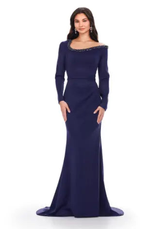 Feel like a queen in the Ashley Lauren 11450 Long Prom Dress. This stunning gown features a long sleeve scuba design, adorned with intricate beadwork and an asymmetrical neckline. Perfect for a formal event or pageant, this dress exudes elegance and sophistication. Can you say chic? This classic long sleeve scuba gown features an asymmetric beaded neckline that is perfect for your next event.