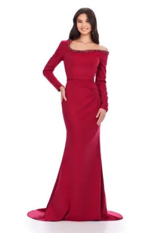 Feel like a queen in the Ashley Lauren 11450 Long Prom Dress. This stunning gown features a long sleeve scuba design, adorned with intricate beadwork and an asymmetrical neckline. Perfect for a formal event or pageant, this dress exudes elegance and sophistication. Can you say chic? This classic long sleeve scuba gown features an asymmetric beaded neckline that is perfect for your next event.