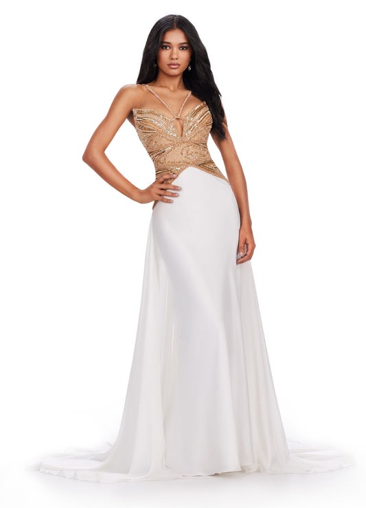 Be a showstopper in this stunning Ashley Lauren 11455 Long Prom Dress. The halter charmeuse gown features a fully beaded top and a V-neck, creating a glamorous look. With a flowing train and elegant silhouette, this dress is perfect for formal events and pageants. Elevate your style with this one-of-a-kind gown. Feel like a goddess in this charmeuse gown with a fully beaded bodice. The dress features a dramatic overskirt and a detailed bodice to make this look absolutely fabulous.