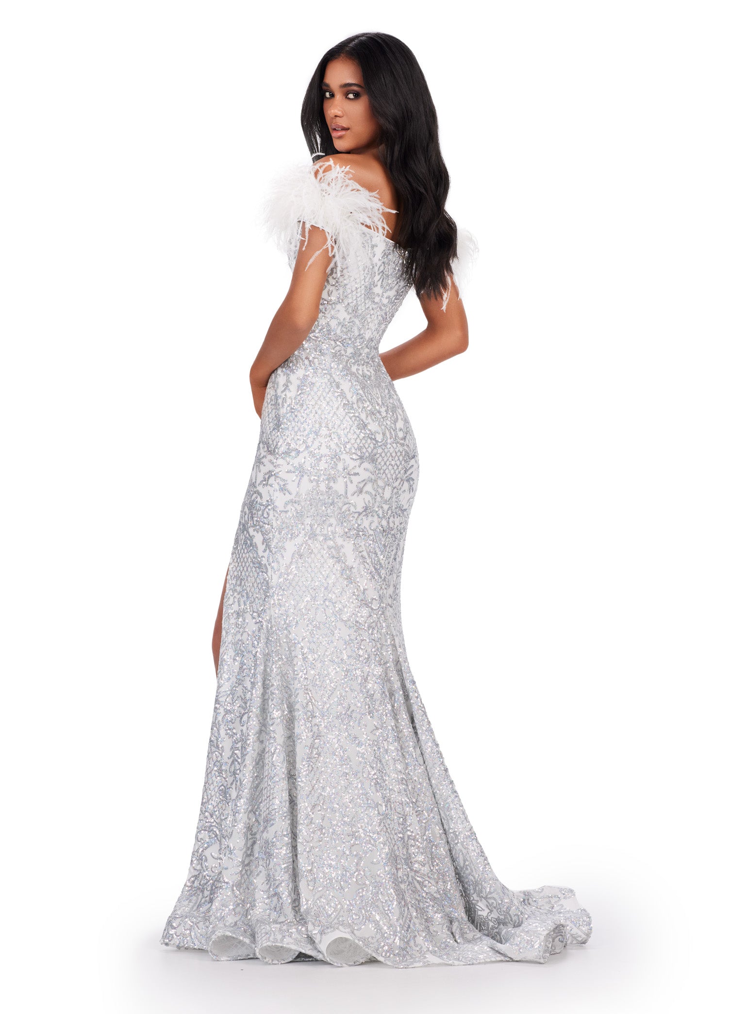 Elevate your prom look with the stunning Ashley Lauren 11463 Long Sequin Mermaid Prom Dress. The off the shoulder design and feather embellishments add a touch of glamour, while the slit detail adds a touch of flirtiness. This dress is perfect for making a statement on your special night. Stand out in this off the shoulder stretch sequin gown. We are living for this sweetheart neckline and feather details.