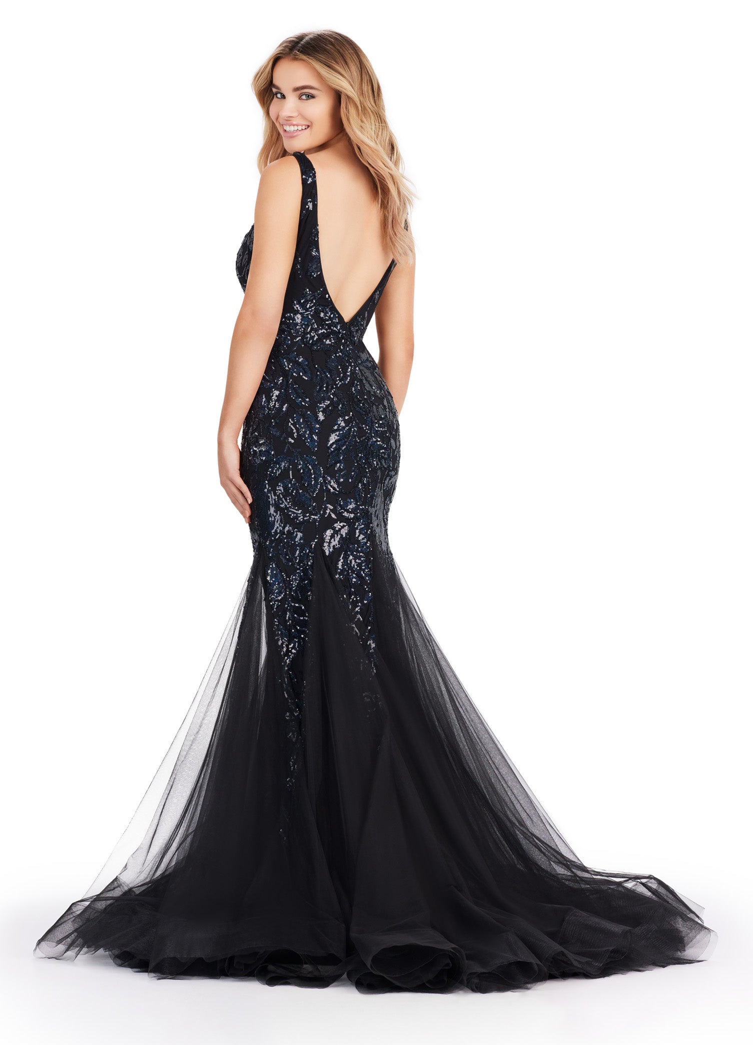Get ready to command attention in the Ashley Lauren 11472 Long Prom Dress. With a stunning V-neck, sequin embellishments, and a mermaid skirt made with stretchy fabric, this gown is designed to enhance your figure and make you shine. Perfect for formal events, pageants, and more. Can you say iconic? This stretch sequin gown features a v-neckline and a pleated tulle skirt to help you slay your next event.
